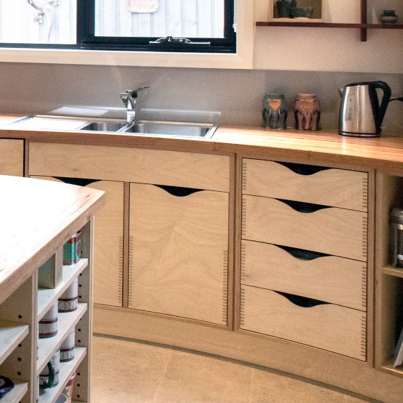 Curved plywood and recycled timber kitchen